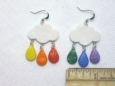 This is a Uniquely Handcrafted pair of Earrings featuring Super Cute Sparkling Rainbow Raindrops & Clouds- featuring a Sparkling dusted Glitter Cloud with Rainbow Colored Sparkling raindrop dangles. Great Fun for Summertime or the Beach :) Completely Handmade Artisan Earrings displaying OUTRAGEOUS Details- Earwires are hypoallergenic. Super FUN- Beautiful Colors Dangle nicely from ears, comfortable weight. - Length = SEE pictures for ruler measurement & DETAILS :) Please SEE my other lis Rainbow Hypoallergenic Earrings As Gift, Single Rainbow Earring For Gift, Rainbow Single Earring As Gift, Rainbow Teardrop Jewelry With Matching Earrings, Rainbow Teardrop Jewelry Set With Earrings, Whimsical Rainbow Dangle Jewelry, Nickel-free Rainbow Teardrop Earrings, Cute Rainbow Jewelry For Pierced Ears, Cute Rainbow Hypoallergenic Earrings