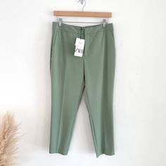 Zara Ankle Pants / Trousers 8 Brand New - With Tags !! Zip + Button Closure. Rear Welt Pockets Hand Pockets Size Us 6 / Eu 38 Color: Mint / Light Green Approx. Measurements: 15" Across Waist 10" Rise 26.5" Inseam 63 % Polyester 33 Viscose 4 Elastane 8073/553 Ww Spring Trousers For Workwear, Spring Workwear Trousers, Green Summer Pants With Button Closure, Trendy Workwear Capris With Pockets, Trendy Spring Pants With Button Closure, Zara Pants For Spring Workwear, Zara Workwear Pants For Spring, Chic Solid Color Capris For Workwear, Summer Workwear Tapered Leg Capris