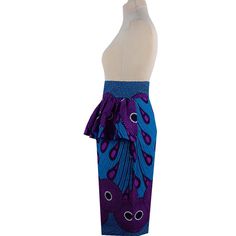 This Ankara Peplum Pencil Skirt features a classic African print entrance and flared peplum waistline. Its pencil silhouette adds a tailored yet chic look that will flatter any body type. Perfect for any occasion, this skirt is sure to be a stunning addition to your wardrobe. Product Features Please Compare your Measurements To our Size Chart Before Purchase Fully Lined Fitted waist Center back seam with invisible zipper Regular fit- true to size Skirt Length is 30 Inches from Waist Hand Wash wi Elegant Printed Skirt, Purple Fitted Pencil Skirt, Fitted Purple Pencil Skirt, Elegant Fitted Printed Bottoms, Fitted Printed Mini Skirt, Printed Fitted Mini Skirt, Chic Fitted Printed Skirt, Fitted Mini Skirt With Print, Chic Fitted Blue Wrap Skirt