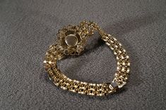 I am offering this fabulous vintage yellow gold tone bracelet. This piece is truly gorgeous, and it has the following features: * beautiful vintage bracelet * line link * stackable * faux pearl * rhinestone * bib style * 7 inches in length This is a fantastic and classic piece. There is tons of sparkle and shine with this piece. It will beautifully complement your upcoming fashion season. Buyer pays all shipping and handling. Formal Gold Jeweled Bracelets, Gold Jeweled Bracelets For Formal Occasions, Victorian Gold Jewelry With Rhinestones, Antique Gold Jewelry With Rhinestones, Gold Costume Jewelry Bracelets For Evening, Victorian Gold Jeweled Bracelets, Vintage Gold Jewelry With Rhinestones, Vintage Round Bracelet With Jewels, Vintage Gold Bracelet For Wedding