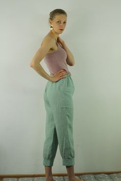 "Write the selected color in the message Women linen pants with 2 pockets in minty green color, perfect for casual wear and suitable for any occasion in any season Details: - 100% natural linen produced in Europe ; - medium weight (180 gram per square meter); - color: grayish blue, can be any from our colors catalogue (color samples at the photo); Made to order, approximately a few days, If you have any questions please message me and I will be glad to answer. Size guide : Size XS Bust: fits bus Green Harem Pants With Pockets For Loungewear, Green High-waisted Bottoms With Side Pockets, Summer Wide Leg Sweatpants With Side Pockets, Spring Casual Light Green Bottoms, Green Summer Harem Pants With Pockets, Green Casual High-waisted Pants, Green Relaxed Fit Pants, Green Relaxed Fit Ankle-length Bottoms, Green Relaxed Fit Ankle-length Pants