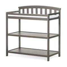 a baby crib that is gray and has two shelves