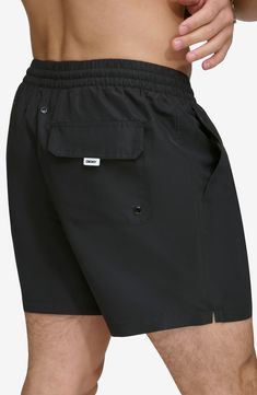 Soak up the sun in these recycled-fiber swim trunks built with UPF 40+ sun protection. 5" inseam (size Medium) Elastic/drawstring waist Front slant pockets; back patch pocket Lined 100% REPREVE polyester REPREVE recycled polyester is made from 100% post-consumer recycled plastic bottles Machine wash, tumble dry Imported Black Bottoms For Beach Season Outdoor, Black Summer Bottoms For Outdoor, Summer Outdoor Black Bottoms, Outdoor Swim Trunks With Drawstring, Short Length, Outdoor Swim Trunks With Drawstring, Relaxed Fit Swimwear With Elastic Waistband For Outdoor, Outdoor Swimwear With Elastic Waistband And Relaxed Fit, Relaxed Fit Nylon Swim Trunks For Outdoor Activities, Relaxed Fit Functional Swim Trunks For Beach