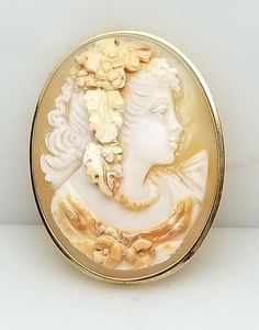 14KT YELLOW GOLD  CAMEO PIN/PENDANT M&M SCOGNAMIGLO NAPLES ITALY 47X36.2MM When cameo becomes an art form can be said about this beautiful conch shell elaborately styled pin/pendant.  The pin was made in Naples, Italy by renowned cameo maker M&M Scognamiglo. M & M Scognamiglo started into business in 1857 and is known world wide for their artistry. This cameo is signed on the backside. The pin has a 14 karat yellow gold frame and has measurements of 47 x 36.2mm. If you enjoy fine cameo work you Vintage Cameo Jewelry, Jewelry Board, Cameo Jewelry, Naples Italy, Vintage Cameo, Jewelry Boards, Pin Pendant, Conch Shell, Naples