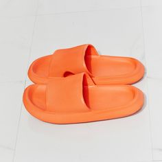 From The Pool To The Supermarket, These Rubber Slides Are All Comfort And All Style. Their Slide-On Design Makes Them Ideal For When You're Running Late, And Their Rubber Composition Makes Them The Perfect Pool Companion. Slide These On With A Matching Lounge Set, Cutoffs And A Tee, Or Biker Shorts And A Crop Cami. - Size: Multiple Available - 6 / 7 / 8 / 9 / 10 - Color: Orange - Width: Standard - Style: Slide Sandal - Open Toe - Rounded Shape - Flat Heel - Slip On - Material: Rubber - Waterproo Orange Flat Slippers For Spring, Comfortable Orange Slides With Round Toe, Comfortable Orange Slide Sandals, Comfortable Orange Round Toe Slides, Comfortable Orange Open Toe Sandals, Orange Flat Synthetic Slippers, Comfortable Orange Slip-on Sandals, Orange Non-slip Flat Sandals, Orange Open Toe Sandals With Textured Footbed