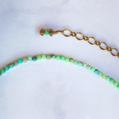 15" long. 4" chain. 19" total length natural green Opal and brass. (No nickel, no lead) Opal Gem-quality opal is one of the most spectacular gemstones. A single stone can flash every color of the spectrum with an intensity and quality of color that can surpass the "fire" of diamond. Opal derives its name from the Latin opalus and Sanskrit upala meaning precious stone. There are three different types of Opal defined as Precious/Rainbow Opals – rarest displaying flashes of iridescent colour, Commo Gemstone Necklace With Ethiopian Opal Round Beads, Bohemian Gold Jewelry With Green Onyx, Bohemian Green Onyx Gold Jewelry, Chrysoprase Jewelry With Natural Stones For Jewelry Making, Adjustable Nickel-free Opal Jewelry, Adjustable Green Artisan Jewelry, Artisan Adjustable Green Jewelry, Green Adjustable Artisan Jewelry, Chrysoprase Gemstone Jewelry With Round Beads