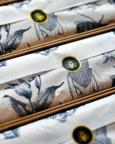 four pieces of paper with pictures of animals and flowers on them are lined up in rows