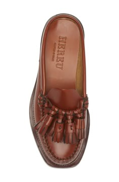 A dramatic cluster of tassels charms the vamp of this playful loafer slashed and reissued as a street-chic mule. Leather upper, lining and sole Made in Spain