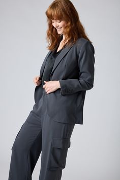 Upgrade your status with this classic blazer. It will work with denim and a tee if you're wanting a bold casual vibe, or pair with your favorite smart pants or skirt for an all over formal look. Regular Sleeve Standard Lapel Pockets Regular Length Buttons Up Gray Semi-formal Blazer With Hidden Button Closure, Classic Blazer, White Blouse, Formal Looks, Moto Jacket, Charcoal Color, Fashion Help, Classic White, Personal Stylist