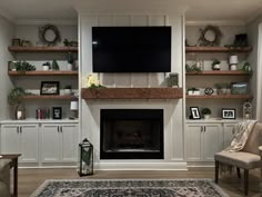 a living room filled with furniture and a flat screen tv mounted on the wall above a fireplace