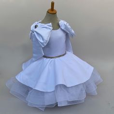 Make your little girl feel like a princess in our enchanting special occasion dress. Crafted from luxurious duchess satin and delicate tulle, this dress exudes elegance and charm. The rhinestone-adorned belt adds a touch of sparkle, making it perfect for weddings, parties, or any special event. Available in sizes for girls, toddlers, and baby girls, this dress is sure to make her feel extra special on any memorable occasion. Size Guide: 1) All our Gowns can be made in any size ranging from girls 3-6 months to Adult Plus Sizes. 2) Ordering based on Size Chart: Before you place your order please compare your measurements to the size chart provided. 3) Ordering Custom: If you choose to submit custom measurements, we will be adding an inch to the chest and waist circumference to allow room for Tulle Flower Girl Dress, Tulle Flower Girl, Duchess Satin, Baby Frocks Designs, Flower Girl Dresses Tulle, Rhinestone Belt, Belt Dress, Special Occasion Dress, Frock Design