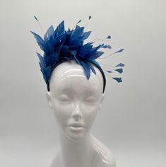 Handmade by Featured Milliner of The Kentucky Derby Museum 2023 & 2024! Lake blue feather mounts on coordinating silk headband. Attaches with headband.  Not taking customs this year--Derby 150 is going to be massive and mom life keeps me running! However, happy to suggest pieces that will coordinate with your outfit. If you don't love the way this attaches to your head--message me!  I can swtich *most* pieces to your preference. Clip, Headband OR Elastic Cord  NOTE: Heavier pieces with extravagant florals etc require the stability of a headband. NO RETURNS/EXCHANGES due to nature of product (special occasion and head wear). Not all screens/lighting are created equal. Make sure you are happy with the color match before ordering! If you have any concerns, let me know--here to help. Just say Feather Trim Costume Hats For Evening Events In Spring, Feather Trim Costume Hats And Headpieces For Spring Evening, Spring Evening Costume Hats With Feather Trim, Summer Races Ostrich Feather Headpiece, Feather Trim Mini Hats For Kentucky Derby Evening, Feathered Fascinator For Races, Kentucky Derby Evening Mini Hat With Feather Trim, Evening Feather Hat Headpiece, Formal Mini Hats With Feather Trim For Spring