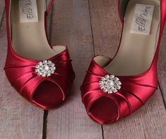 "Dress up your wedding day with these 1 3/4\" peeptoe wedding shoes (measured like this: http://www.customweddingshoe.com/how-heel-height-is-measured.html). These lovely wedding shoes are shown here in rouge satin and feature our simple rhinestone adornment on the toe. Color Change: Want this shoe in a different color? We can change the base shoe color for you! To order this shoe in a different color, please send us a CUSTOM REQUEST. To view our catalogue of colors, please visit our website at: Red Low Heel Wedding Shoes, Elegant Red Wedding Shoes With 4-inch Heel, Red Fitted Wedding Shoes With Round Toe, Elegant Red Low Heel Wedding Shoes, Red Wedding Shoes With 4-inch Heel, Red Low Heel Wedding Heels, Elegant Red High Heel Wedding Shoes, Red Open Toe Wedding Shoes, Elegant Red Open Toe Wedding Shoes