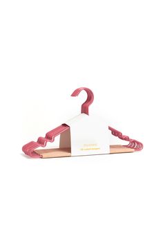 a pink and white house shaped hanger