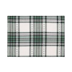 a green and white plaid rug on a white background