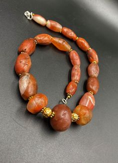 The Rare Unique PEMA RAKA Carnelian Amulet Prayer Beads Necklace From Himalayan Tibet The Age Of This Beads Are More than 1000 years Old As You Can See From Its Conditions Very Oily Smooth Skin Of This Pema Beads Some Gold Plated Wax and Gold Color Brass Beads Are Used As Spacers Rare Items For Collections Rare Items, 1000 Years, Brass Beads, Carnelian Beads, Prayer Beads, Agate Beads, Beads Necklace, Beads Jewelry, Himalayan