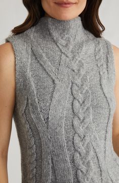 Start sweater season a bit early this year with the arm-bearing style of this sweater-vest knit from soft, silky yarns with classic, chunky cables and topped with an elegant funnel neck. Funnel neck 63% acrylic, 37% nylon Machine wash, dry flat Imported Vest Knit, Hair Socks, Funnel Neck Sweater, Sweater Season, Brighton Jewelry, Sweater Tank, Loungewear Shorts, Funnel Neck, Scarf Hairstyles