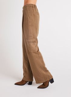 Introducing our latest addition, Jules Pleated Wide Leg. With cargo pockets and pleated detailing. Whether you're going for a casual or a more polished look, this cargo pant is the perfect choice for any occasion. 55% Linen 45% TENCEL™ Lyocell. SIZE WAIST WAIST TO HEM RISE INSEAM XS 26 1/2" 43" 11 7/8" 31 1/2" S 28 1/2" 43 1/2" 12 1/2" 31 1/2" M 30 1/2" 44" 13 1/8" 31 1/2" L 32 1/2" 44 1/2" 13 3/4" 31 1/2" Brown Straight Leg Utility Cargo Jeans, Brown Utility Cargo Jeans With Straight Leg, Brown Cargo Jeans With Side Pockets For Fall, Brown Relaxed Fit Cargo Jeans For Fall, Brown Full Length Utility Cargo Pants, Fall Brown Cargo Jeans With Belt Loops, Brown Utility Cargo Jeans For Fall, Fall Workwear Cargo Jeans, Brown Cargo Style Bottoms For Workwear