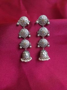 3.3 inches long Bohemian Silver Dual-tone Earrings, Elegant Dual-tone Metal Earrings, Dual-tone Chandbali Danglers, Gold Dual-tone Brass Earrings, Oxidized Brass Jhumkas, Dual-tone Drop Danglers, Temple Jewelry Style Metal Drop Earrings, Festive Metal Plug Earrings With Latkans, Dual-tone Chandbali Jhumkas