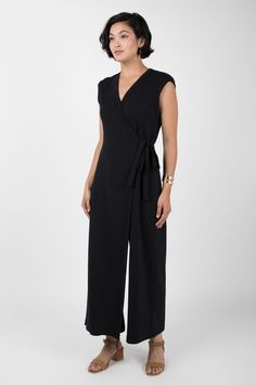 https://indigenous.com/collections/organic-cotton-dresses/products/wrap-jumpsuit?variant=31756316737633 Casual V-neck Jumpsuit With Button Closure, Green V-neck Cotton Jumpsuit, Green Cotton V-neck Jumpsuit, Fitted V-neck Jumpsuit With Button Closure, Relaxed Fit Linen Jumpsuit With V-neck, Wrap Jumpsuit, Organic Cotton Dress, Fair Trade Clothing, Boat Neck Dress