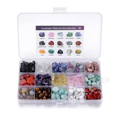 a plastic box filled with lots of different colored rocks and stones in it's compartments