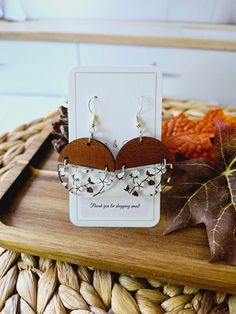 The perfect accessory for transitioning from summer to fall, these Fall Earring will add a colorful change to all your outfits! Crafted with natural wood with an acrylic image of cotton, these earrings are lightweight and comfortable to wear. Great for both casual and formal occasions, these earrings will have you fall-ing in love! Silver Earring Hooks They are lightweight and easy to wear. CARING FOR YOUR JEWELRY: * Please remove earrings before bathing and swimming. Material: Hypoallergenic Earring Hooks. Nickel-free with anti-allergy can be used for sensitive skin REFUNDS/EXCHANGES We cannot offer exchanges on earrings due to sanitary conditions of wearing in earlobe. If you item is damaged during shipping, we will be happy to replace your item! Please provide an image of the damaged pr Brown Single Hoop Earring As Gift, Unique Brown Hoop Earrings For Gift, Brown Dangle Flower Earrings For Pierced Ears, Brown Hoop Earrings With Ear Wire For Gift, Nature-inspired Dangle Earrings For Everyday Wear, Brown Dangle Earrings Nature-inspired, Nature-inspired Earrings For Everyday, Everyday Nature-inspired Dangle Earrings, Nature-inspired Everyday Pierced Earrings