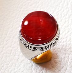 Aqeeq agate carnelian ring sterling silver 925 red natural round flat semi precious stone all sizes fast shipping middle eastern jewelry Risk free Quality guarantee policy : If you are not satisfied with your item for any reason simply send it to us and you will get a replacement or refund . please write or choose your size with the order and we will size it for you . Our ring is handcrafted mostly with a few simple tools . but some methods are used in casting like lost wax method . sterling sil Carnelian Signet Ring With Polished Finish, Red Cabochon Round Gemstones, Red Cabochon Gemstones, Carnelian Signet Ring Gift, Round Agate Gemstone Signet Ring, Red Round Cabochon Gemstones, Agate Gemstone Signet Ring, Handmade Agate Signet Ring, Elegant Round Carnelian Signet Ring