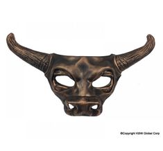 an oxen mask with long horns on it's face is shown against a white background