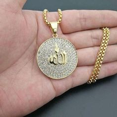 Proudly Display your Faith in Allah with this Shimmering CZ Gold Allah Necklace. Material: stainless steel with gold plating accented with cz Lengths: chain: 26 in, with no extension, pendent: 1.5 in Elegant gift box Included Do you wish this necklaces was just a little bit longer? Add one of these stainless steel necklace extender to achieve the perfect length, available in gold or silver tone. Allah Necklace, Big Blue Whale, Allah Pendant, Prayer Jewelry, Islamic Jewelry, Head Ring, Necklace Extender, Gold Jewelry Sets, Round Pendant Necklace