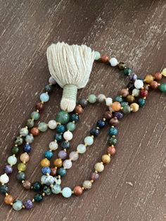 Let me make a mala for you. Handmade Multicolor Bohemian Mala, Bohemian Multicolor Handmade Mala, Bohemian Hand Knotted Mala For Meditation, Handmade Multicolor Healing Mala, Handmade Multicolor Mala For Healing, Bohemian Hand Wrapped Mala For Meditation, Multicolor 108 Beads Mala As Gift, Bohemian Hand Wrapped Mala With Round Beads, Adjustable Multicolor Mala As Gift