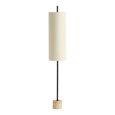 a floor lamp with a white shade on the top and a black pole underneath it