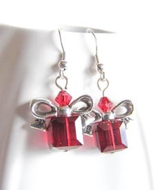 Beautiful, red cube beads are topped with a silver plated bow just like a Christmas present. Give the Christmas spirit as a gift or keep the earrings for yourself! Great as stocking suffer too! The earrings are 1.25in long (3.5cm) with Surgical steel fishhook earwire. For larger selection you can visit my shop: http://www.etsy.com/shop/EvaLineJewelry?ref=si_shop Gift-ready Silver Jewelry, Red Christmas Jewelry Gift, Holiday Dangle Jewelry Gift, Red Jewelry Christmas Gift, Holiday Dangle Jewelry For Gifts, Holiday Gift Dangle Jewelry, Silver Holiday Jewelry Gift, Holiday Silver Jewelry Gift, Red Jewelry For Christmas Gift