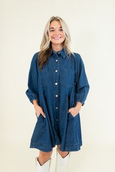 Collared Pockets at bust and side Long sleeves with elastic cuffs Lightweight Non-sheer 100% Cotton SIZES: SMALL MEDIUM LARGE Game day or concert, this denim dress has got your back. Featuring a full button-up front and long sleeves, this mini dress is perfect for any fall event. Pair with boots and a hat for a country vibe, or sneakers for a sporty look. SIZE XS S M L XL 2XL 3XL FITS A SIZE 00-0 2-4 6-8 10-12 14-16 18-20 22-24 Medium Wash Button-up Dress For Daywear, Dark Wash Buttoned Dress For Fall, Dark Wash Long Sleeve Dress With Buttons, Long-sleeve Denim Dress For Casual Spring Wear, Long Sleeve Denim Dress For Casual Spring Wear, Long Sleeve Denim Dress For Casual Spring Days, Long Sleeve Denim Dress For Dress Down And Spring, Relaxed Fit Light Wash Denim Dress For Fall, Long Sleeve Medium Wash Denim Dress For Day Out