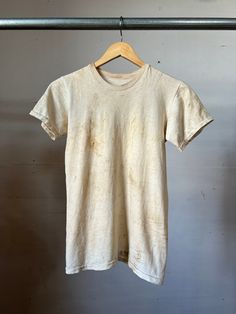 "Vintage military cotton T-shirt with name stencil on the bottom. Has lots of stain and wear.  Measurements flat: 15\" Pit to Pit  22\" Length  All sales final, Please ask any questions before buying! Thanks!" Vintage Pre-washed Cotton T-shirt, Vintage Faded T-shirt Pre-washed, Vintage Acid Wash Pre-washed T-shirt, Acid Wash Cotton T-shirt With Natural Dye, Short Sleeve Cotton T-shirt With Natural Dye, Vintage Cotton Pre-washed T-shirt, Faded Cotton Tops Pre-washed, Cotton Short Sleeve T-shirt, Vintage Pre-washed Crew Neck T-shirt