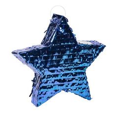 a shiny blue star ornament hanging from a ceiling