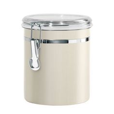 a cream colored canister with a metal handle