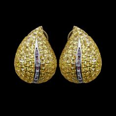 Invisible Setting earrings featuring semi precious canary yellow stone and cz diamonds in leaf shape. Ideal jewelry to pair with your bridal wedding gown or any special occasion outfit. These LUXUEY Earrings surely elevate your look. Perfect gift for her. *𝐏𝐑𝐎𝐃𝐔𝐂𝐓 𝐃𝐄𝐓𝐀𝐈𝐋* * 𝐌𝐚𝐭𝐞𝐫𝐢𝐚𝐥: Brass * 𝐏𝐥𝐚𝐭𝐢𝐧𝐠: White Rhodium Plated * 𝐒𝐭𝐨𝐧𝐞: AAA-quality CZ Yellow Diamond. *𝐃𝐈𝐌𝐄𝐍𝐒𝐈𝐎𝐍𝐒* * 𝐖𝐞𝐢𝐠𝐡𝐭: 9 gm each * 𝐋𝐞𝐧𝐠𝐭𝐡: 1.2 Inches * 𝐖𝐢𝐝𝐭𝐡:  0.8 Inches * Luxury Yellow Diamond Drop Earrings, Wedding Yellow Diamond Earrings With Accents, Yellow Diamond Earrings With Diamond Accents For Wedding, Yellow Diamond Earrings With Accents For Wedding, Yellow Diamond Drop Earrings Fine Jewelry, Elegant Yellow Diamond Earrings With Accents, Elegant Yellow Diamond Earrings With Diamond Accents, Elegant Yellow Earrings With Diamond Accents, Luxury Yellow Teardrop Earrings