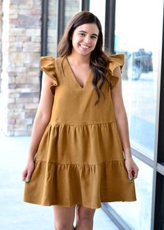 This corduroy dress has a ruffle sleeve, vneck, and tiered ruffle bottom! Perfect with western boots! Victoria is wearing a small. Tent Sale, Corduroy Dress, Hair Accessories Jewelry, Cardigan Jacket, Western Boots, Jeans Pants, Bottoms Pants, Homecoming Dresses, Vest Jacket