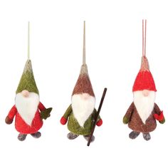 three christmas ornaments hanging from strings on a white background, one is wearing a santa claus suit and the other has a stick in its mouth