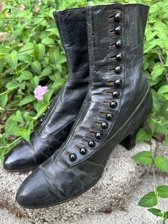 One of many antique shoes I have for sale! A pair of Antique (c1910s) button up boots/shoes. Womens "granny" style with classic spool heels. Jet Black color in a smooth leather fabric. Cotton twill lining. *Refer to condition comments below. made by: Wichert Shoes-New York, US Size: no size indicated, refer to measurements below. These boots tend to be more narrow than modern, please check widths carefully.  Measurements: -inner footbed measurement 8-8.5" -outer sole length-toe tip to back of the heel is 9.5" Heel height is 2.5" Width of sole 2 7/8"  (widest part of the sole) Boot height 8.25" tall Arch 9.5" (around arch of foot) 14 button sets CONDITION: pre-owned antique condition.   NOTABLE ISSUES: Creases/wear/marks in the leather.  Wear on the soles. Refer to photos for up close detai Jet Black Color, Witch Boots, Spool Heel, Mens Shoes Boots, Leather Fabric, Dress With Boots, Smooth Leather, Me Too Shoes, Shoes Mens