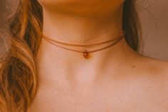 This is a double layered choker necklace featuring a brown glass teardrop on our premium rust brown cord. Adjustable with four fixed length options with a gold lobster claw closure. VIEW MORE TEARDROP NECKLACES HERE: https://etsy.me/2TthVF2 ✺ SIZE GUIDE ✺ ⌁ This choker is designed to comfortably adjust to a minimum of 13 inches to a maximum of 16 inches. If you need a different size, please message me before purchasing. ⌁ How to measure your neck size: If you don't have a seamstress tape measure Charis Core, Hippie Choker Necklace, Minimalist Necklaces, Dainty Gemstone Necklace, Teardrop Jewelry, Rock Necklace, Layered Choker Necklace, Hawaiian Jewelry, Anchorage Alaska