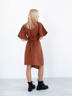 "MARY is a short sleeve robe style linen wrap dress with a self tie belt. DETAILS - Self tie belt with no closure or belt loops - Dolman style sleeves - Knee length - 100% lightweight European linen fabric - Cut and sewn to order just for you in our studio COLOR - Rust, you can also choose other colors above - Fabric samples are available here https://www.etsy.com/listing/586569696/linen-fabric-samples SIZING & FIT - Relaxed fit - True to size - Measurements taken from a size XS - Model is 5 Fitted Linen Belted Shirt Dress, Belted Linen Wrap Dress, Linen Wrap Dress With Belt, Belted Linen Shirt Dress For Work, Summer Linen Belted Shirt Dress, Short Sleeve Wrap Dress With Tie Waist For Work, Brown Short Sleeve Dress With Tie Waist, Belted Short Sleeve Linen Midi Dress, Linen Belted Midi Dress With Short Sleeves