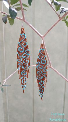 These handmade author's earrings are made of high-quality Czech beads and strong synthetic thread.In these unique earrings I use my author's scheme Abstract flowers minimalism . Color: brown,turquoise . I will make these earrings for you in your color. I beg you not to copy my authoring Copy without my permission is prohibited For those who want to buy my copyright scheme for these earrings: https://www.etsy.com/uk/listing/930475988/brick-stitch-pattern-for-seed-bead?ref=shop_home_active_1 100% Brown Dangle Beaded Earrings With Tiny Beads, Brown Teardrop Beaded Earrings With Colorful Beads, Brown Teardrop Beaded Earrings, Adjustable Brown Beaded Earrings With Dangling Beads, Artisan Brown Beaded Dangle Earrings, Handmade Brown Teardrop Beaded Earrings, Handmade Brown Dangle Chandelier Earrings, Brown Tiny Beads Earrings For Gift, Brown Handwoven Drop Earrings