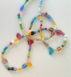 A lovely petite pastel  multi-colored short necklace, comprised of differing glass beads, shapes and colours. Beaded Memory Wire Bracelets, Pastel Beads, Beaded Memory Wire, Wooden Bead Necklaces, Casual Jewelry, Beaded Accessories, Resin Beads, Short Necklace, Beaded Necklaces