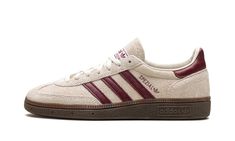 a white and maroon adidas sneakers