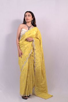 100% Pure Viscose Gold Tissue Saree For Women | Wedding Wear A tissue saree is a type of saree made from tissue fabric, which is a lightweight, sheer fabric with a subtle shimmer. Tissue fabric is often made from silk or synthetic fibers and is known for its delicate texture and elegant drape. Tissue sarees are popular choices for special occasions such as weddings, parties, and festivals due to their luxurious appearance and graceful flow. These sarees may be adorned with embellishments such as Wedding Tissue Silk Pre-draped Saree With Self Design, Yellow Organza Pre-draped Saree For Eid, Yellow Chanderi Saree For Reception, Tissue Silk Saree With Traditional Drape For Reception, Cotton Silk Saree For Wedding With Traditional Drape, Yellow Raw Silk Saree For Reception, Yellow Organza Saree With Pallu, Yellow Organza Saree With Cutdana, Cotton Silk Pre-draped Saree For Wedding And Eid