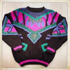 "NOVO SWEATER Description: Vintage Men's 80s NOVO Ski Sweater Jumper. Colors: Black, Pink, Purple & Green. New Wave Bold Abstract Design. Black Pleather Details. Amazing Craftsmanship. 60% Acrylic, 22% Polyester, 18% Mohair. Label: NOVO Sweater. Size: Medium. AWESOME 80s ABSTRACT SWEATER! Flat Measurements: Size: Medium. Chest: Armpit to Armpit - 26\" (approximately 52\" total) Length: Shoulder to Bottom of Hem - 26\" Sleeve Length: Shoulder to Bottom of Cuff - 22\" For best fit, please compare measurements with a Sweater of your own. Circa 1980s Excellent Vintage Condition" Retro Purple Sweater For Winter, Retro Purple Winter Sweater, Vintage Fitted Sweater For Streetwear, Abstract Sweater, 1980s Fashion Trends, Mens 80s, Streetwear Ideas, 80s Sweater, Sport Sweater