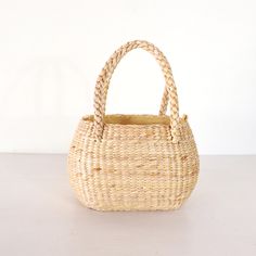 Unveil the charm and elegance of our high-quality, beautifully handcrafted Straw Weave Handbags, perfect for beach outings, shopping trips, and everyday use. Measurements : Height : 15 cm. / 6 inches Width : 20 cm. / 8 inches Depth : 10 cm. / 4 inches ✨ Explore Our Collection: Discover the latest styles of popular handbags, each thoughtfully designed to be both functional and fashionable. Handcrafted by talented local artists in Thailand, our Straw Weave Handbags are made from sustainable water hyacinth, ensuring durability and eco-friendliness. 💖 Why Choose Our Handbags: Artisanal Excellence: The exquisite craftsmanship and attention to detail make each bag unique and one-of-a-kind. Created with love and care, our handbags reflect the skill and dedication of our artisans. Versatile Style Elegant Basket Straw Bag With Rolled Handles, Elegant Natural Crochet Basket Bag, Picnic Bag With Bamboo Handle In Natural Color, Basket Bag With Bamboo Handle For Picnic, Natural Bag With Bamboo Handle For Picnic, Picnic Basket Bag With Bamboo Handle, Handwoven Natural Bags For Picnic, Picnic Basket Bag With Braided Handles, Natural Basket Shoulder Bag For Picnic