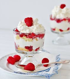 two small desserts with raspberries and whipped cream