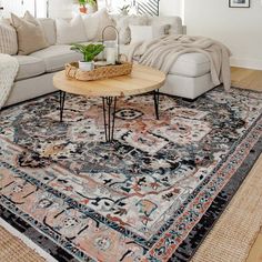 a living room filled with furniture and a rug